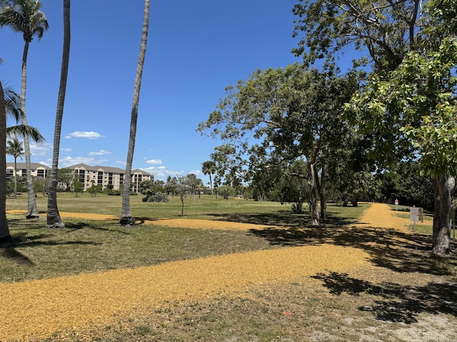 view of home's community featuring a lawn