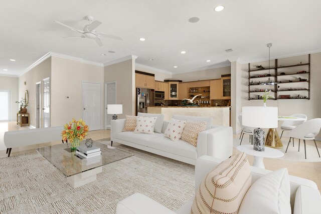 living room with ceiling fan and ornamental molding