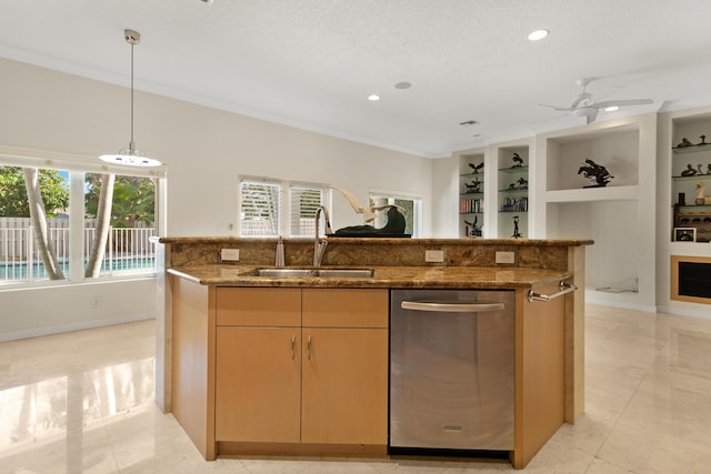 kitchen with stone counters, sink, stainless steel dishwasher, and a kitchen island with sink