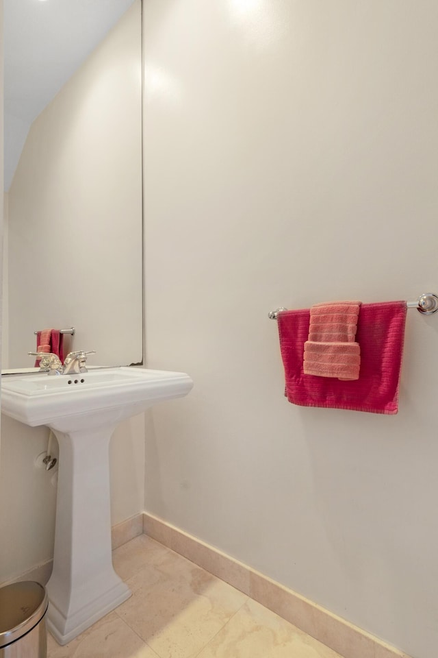 bathroom with sink and tile patterned flooring