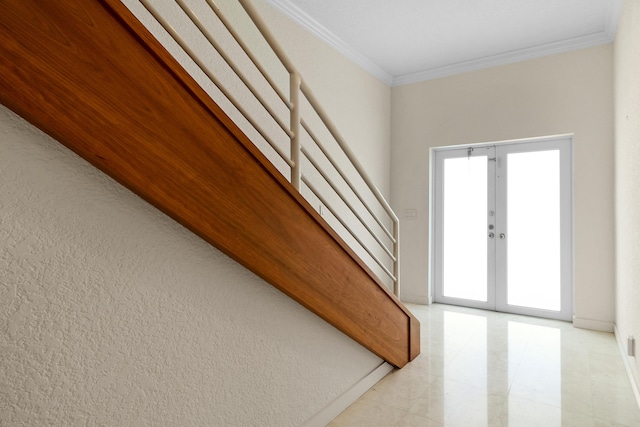 interior space with crown molding and french doors