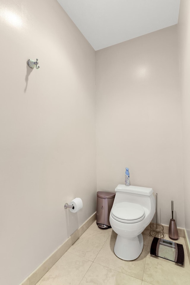 bathroom with tile patterned floors and toilet