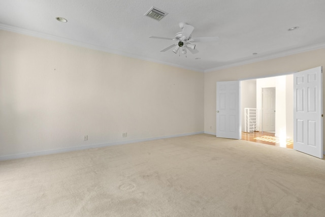 unfurnished room with light carpet, ornamental molding, and ceiling fan