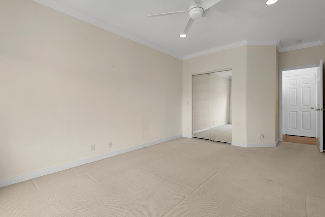 unfurnished bedroom with ceiling fan, ornamental molding, carpet flooring, and a closet