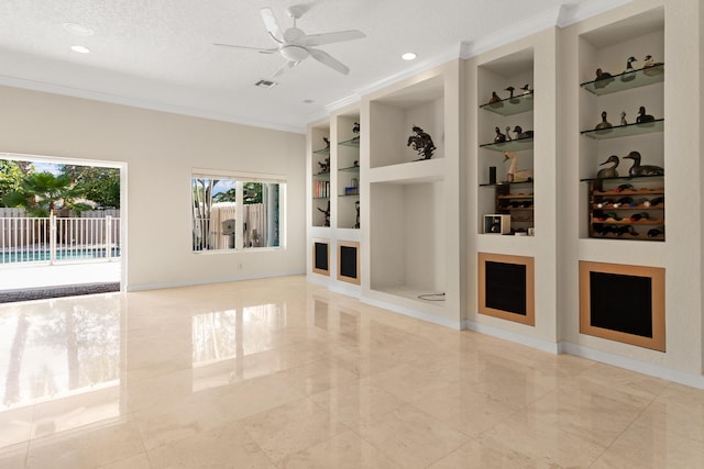 spare room with ceiling fan, built in shelves, ornamental molding, and a textured ceiling