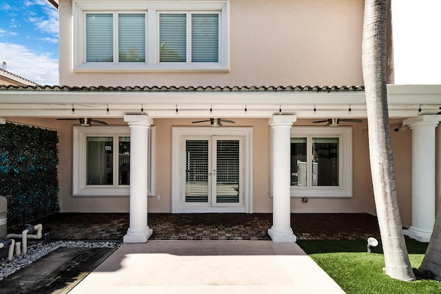 doorway to property featuring french doors and ceiling fan