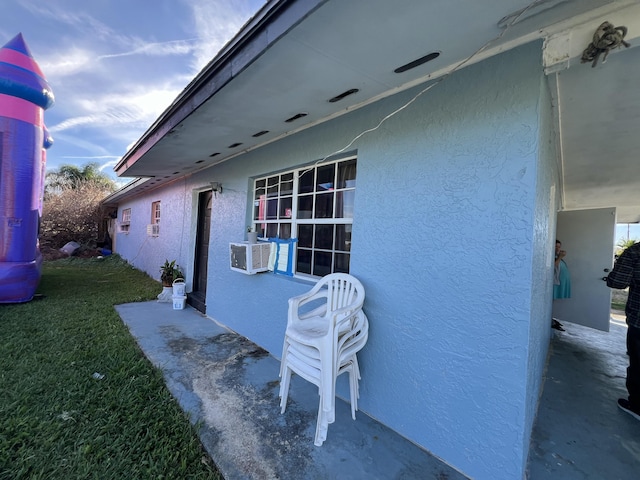 view of property exterior with a lawn