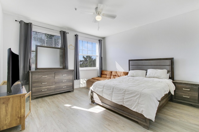 bedroom with ceiling fan and light hardwood / wood-style floors