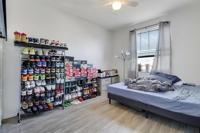 bedroom featuring light hardwood / wood-style flooring and ceiling fan