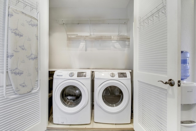 laundry area with independent washer and dryer