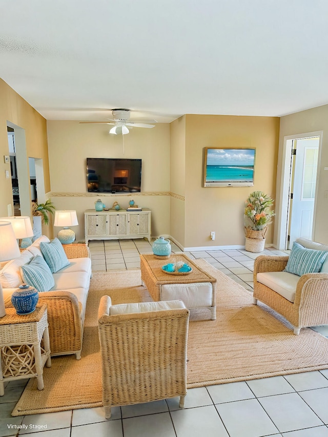 living room featuring tile patterned floors and a ceiling fan