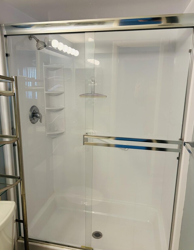4731 Sable Pine Cir Unit A1, West Palm Beach, FL 33417 - bathroom featuring visible vents, vanity, a shower stall, and toilet