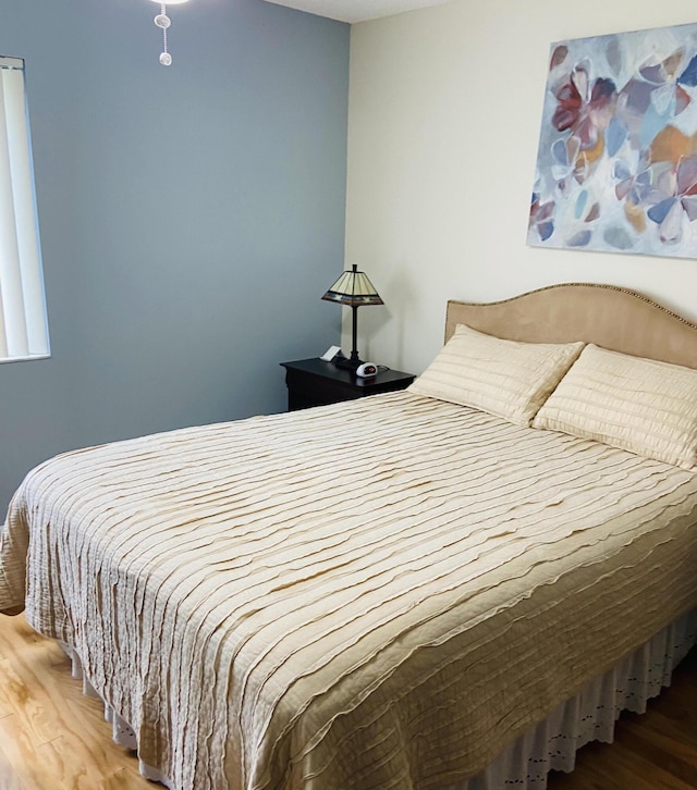 bedroom featuring hardwood / wood-style floors