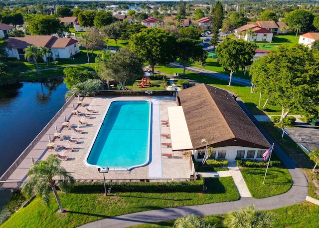 view of pool with a water view