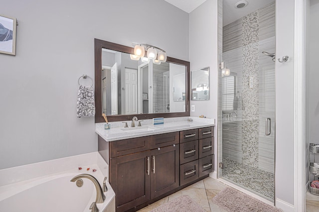 bathroom featuring shower with separate bathtub, vanity, and tile patterned floors