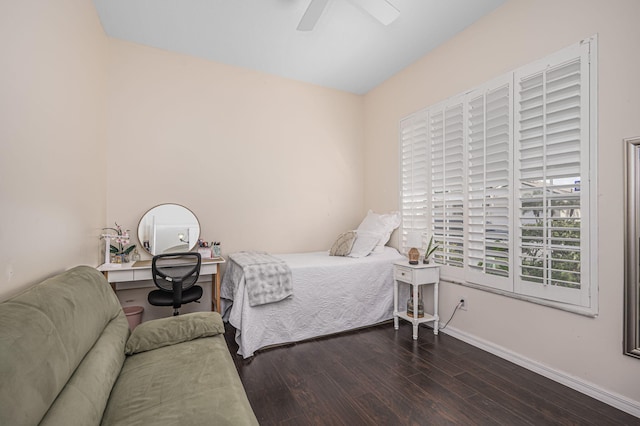 bedroom with ceiling fan and dark wood-type flooring