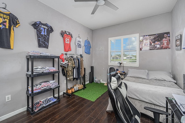 bedroom with ceiling fan and dark wood-type flooring