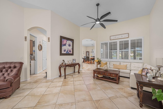 living room featuring ceiling fan and light tile patterned flooring