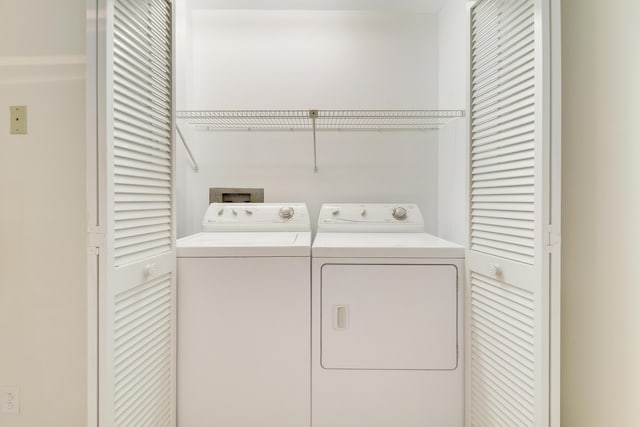 washroom with separate washer and dryer