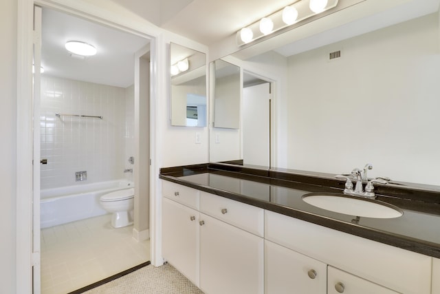 full bathroom with toilet, vanity, tile patterned floors, and tiled shower / bath