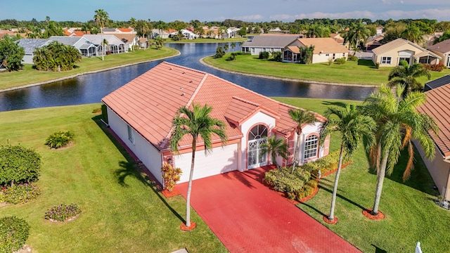 birds eye view of property featuring a water view