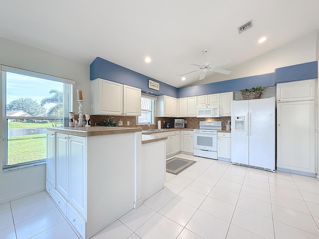 kitchen featuring white cabinetry, ceiling fan, lofted ceiling, white appliances, and decorative backsplash