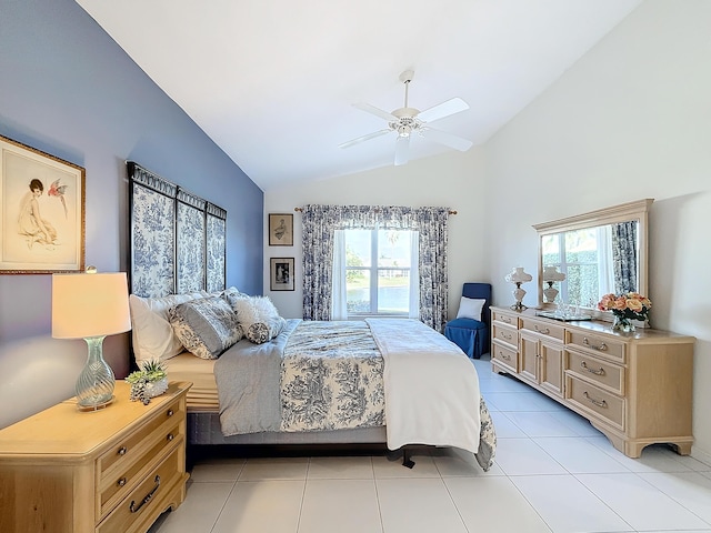 bedroom featuring ceiling fan, lofted ceiling, and light tile patterned flooring