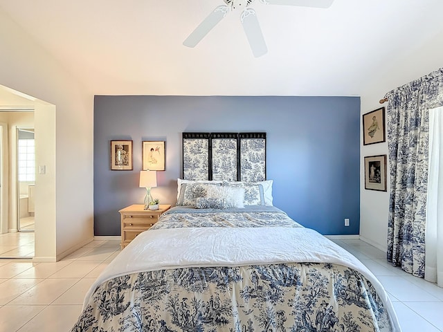 bedroom with ceiling fan and light tile patterned floors