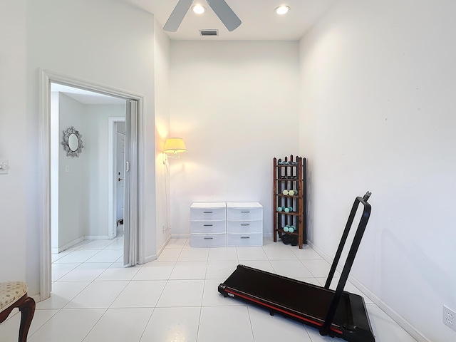 interior space with ceiling fan and light tile patterned flooring