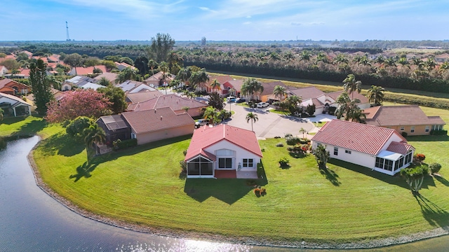 drone / aerial view with a water view