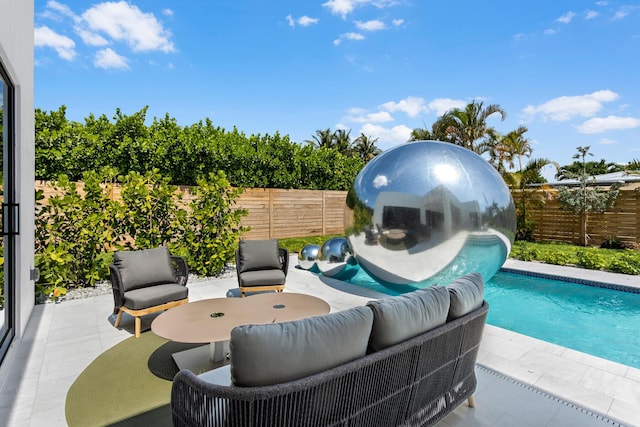 view of swimming pool featuring a patio area