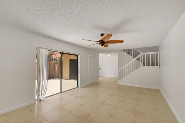 unfurnished room with ceiling fan