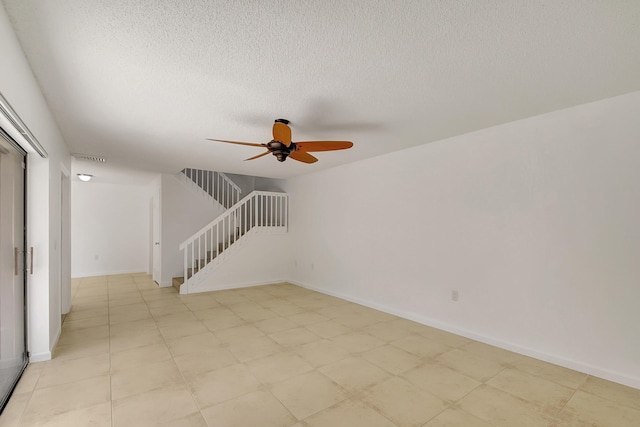 spare room with ceiling fan