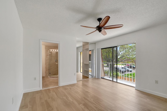 spare room featuring ceiling fan, a textured ceiling, and light wood-type flooring