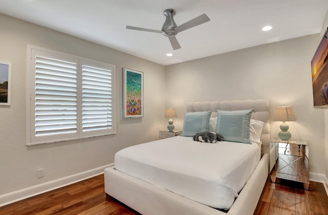 bedroom with ceiling fan and dark hardwood / wood-style floors