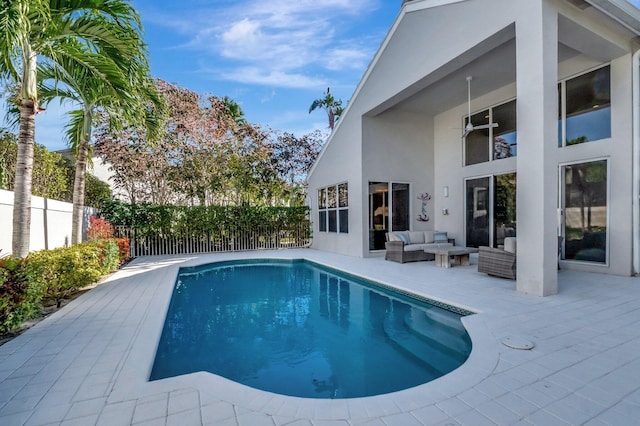 view of swimming pool featuring an outdoor living space and a patio