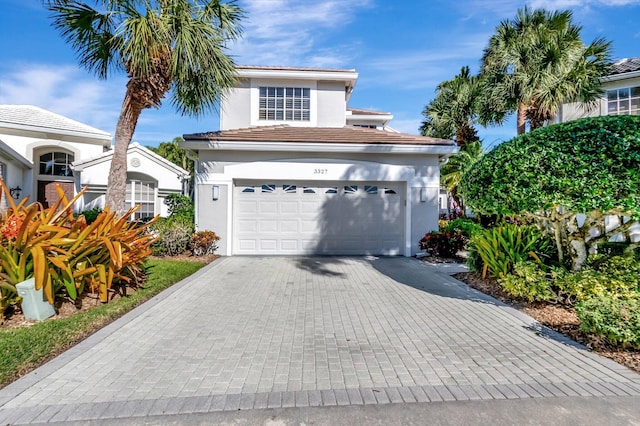 front facade with a garage