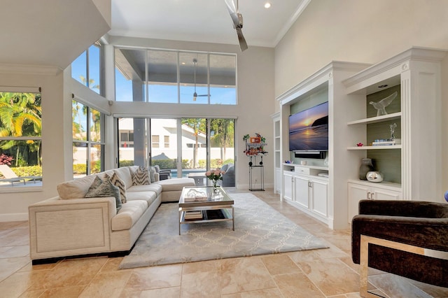 living room featuring built in features, crown molding, and a towering ceiling