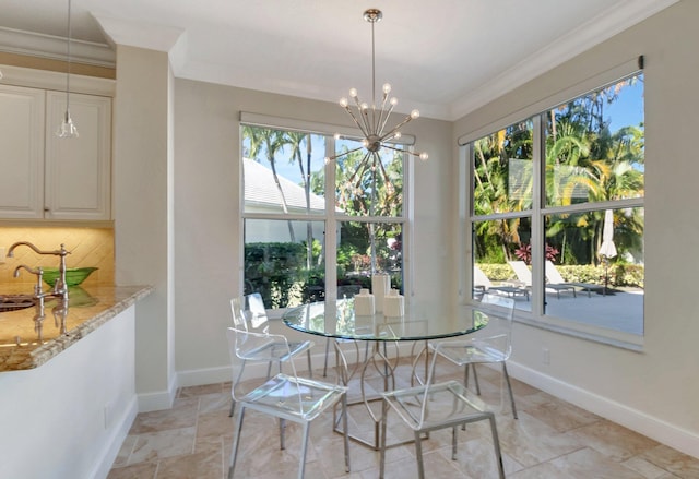 dining space featuring plenty of natural light, crown molding, and a chandelier