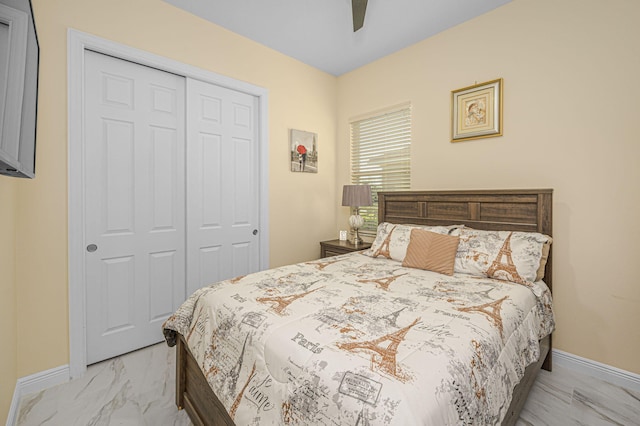 bedroom featuring ceiling fan and a closet