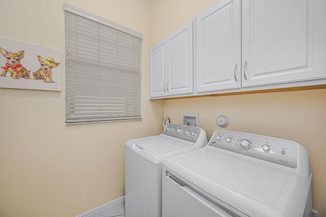 laundry area featuring cabinets and independent washer and dryer