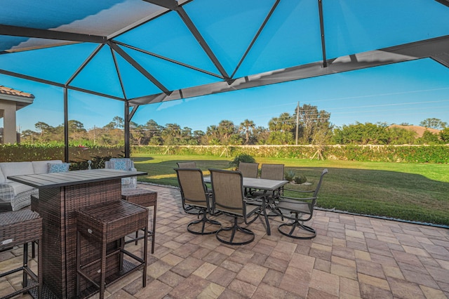 view of patio / terrace featuring a lanai