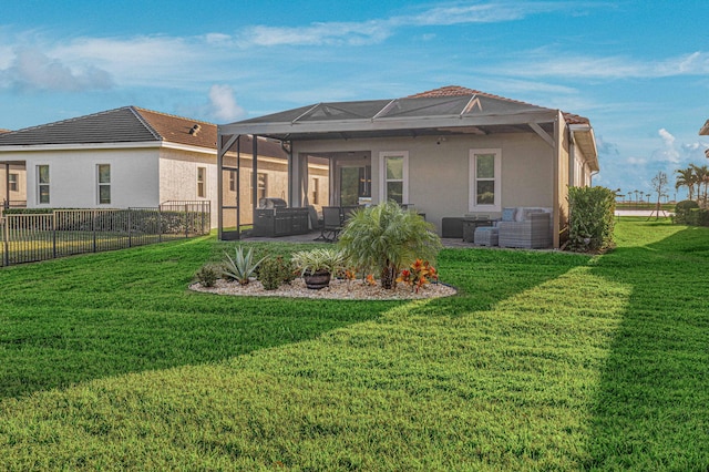 back of house with an outdoor hangout area, a patio area, and a lawn