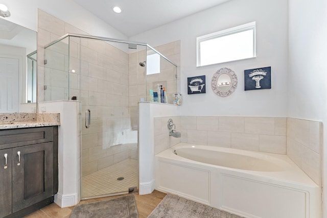 bathroom with vanity and independent shower and bath