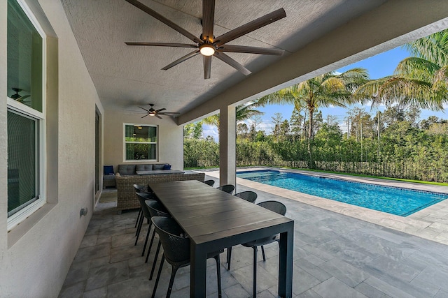 view of pool featuring a patio area and ceiling fan