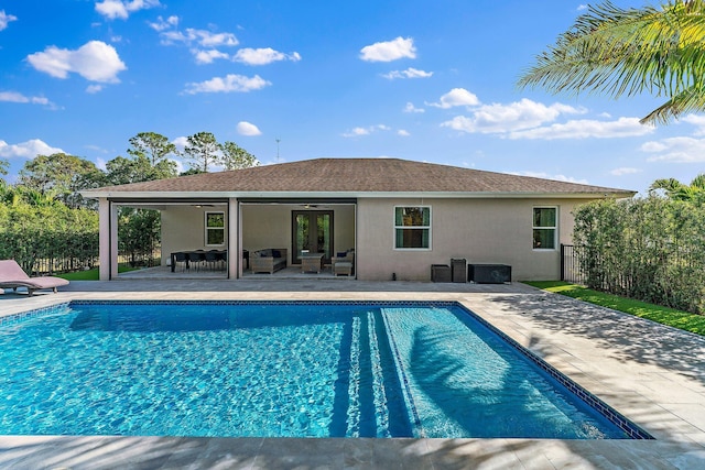 view of pool featuring an outdoor living space, ceiling fan, and a patio area