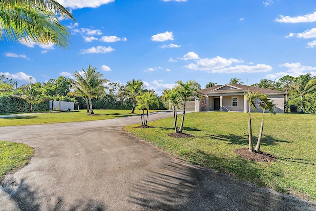 view of front of property with covered porch and a front lawn