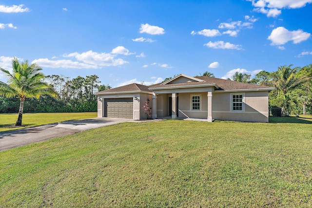 single story home featuring a garage and a front lawn