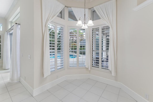 unfurnished dining area with tile patterned floors and a chandelier