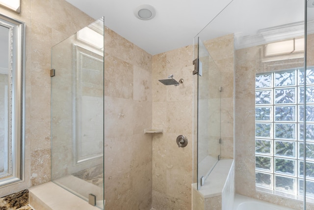 bathroom with shower with separate bathtub